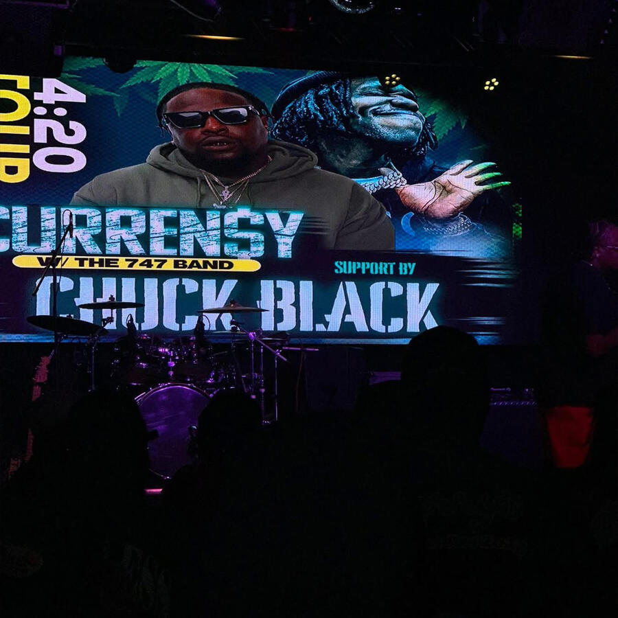 Chuck Black and Currensy stage screen at Elevation 27 Chuck Black and Currensy on Elevation 27 420 Tour stage screen